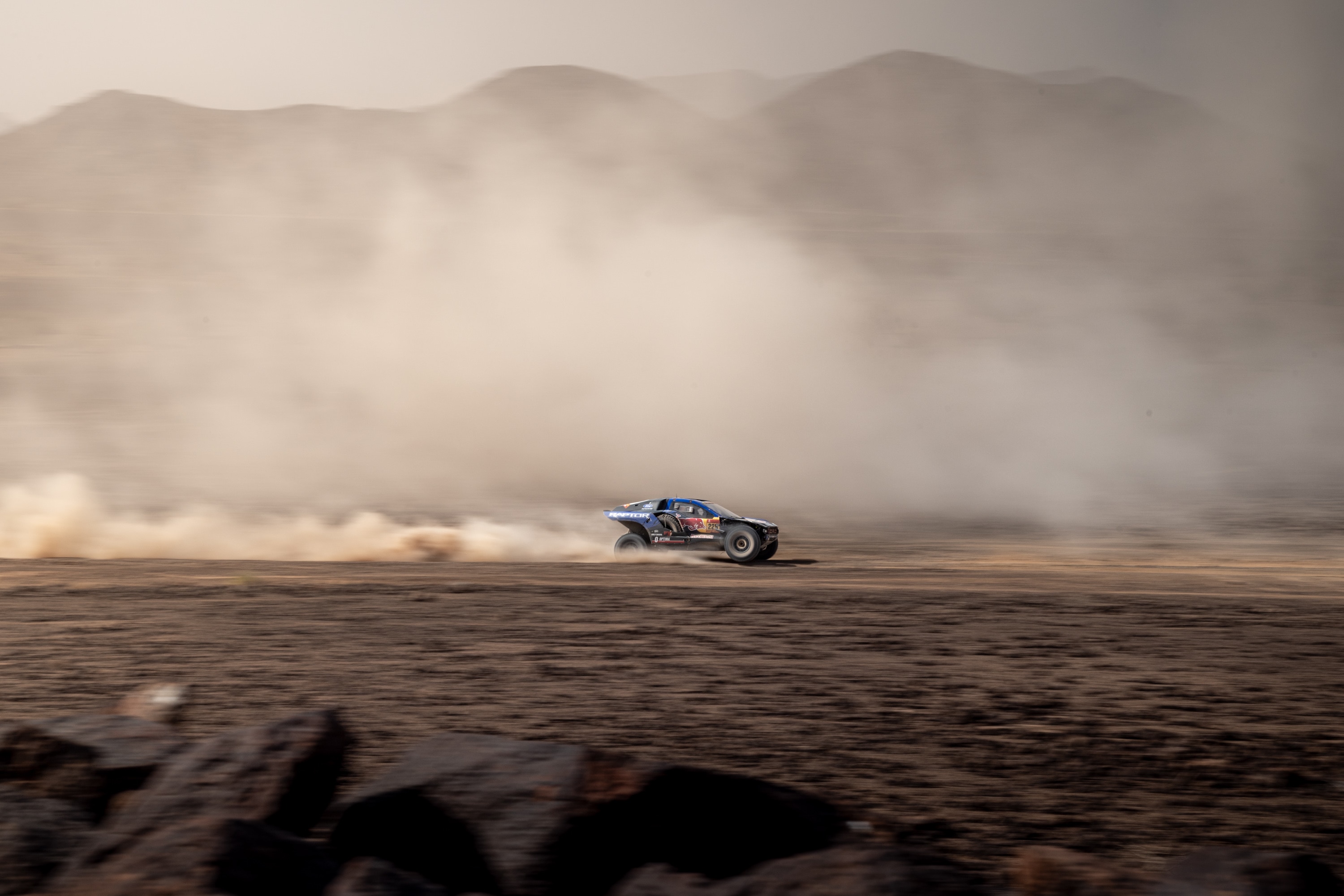 A Raptor T1+ barrels through the desert.